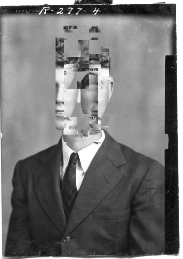 a man in a suit and tie with multiple pieces of paper covering his face to make him look like he is looking at the camera