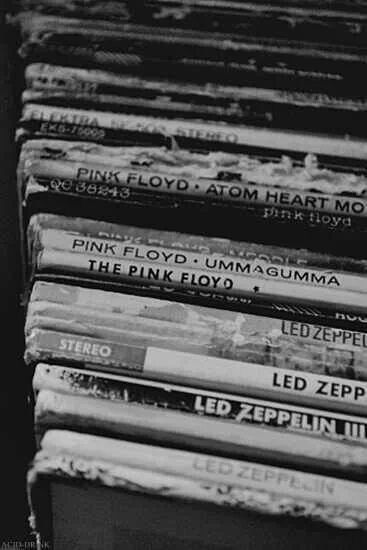 a stack of cds sitting on top of each other