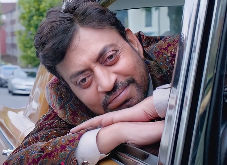 a man leaning out the window of a car