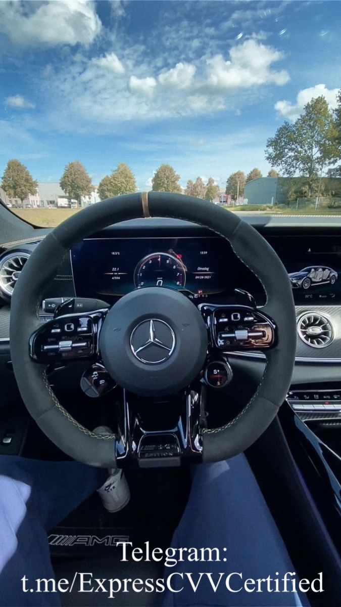 the interior of a car with steering wheel and dashboard