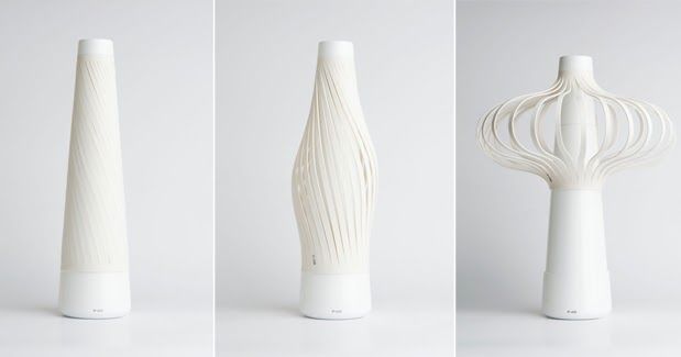 three different views of a white vase with a whisk on it's side