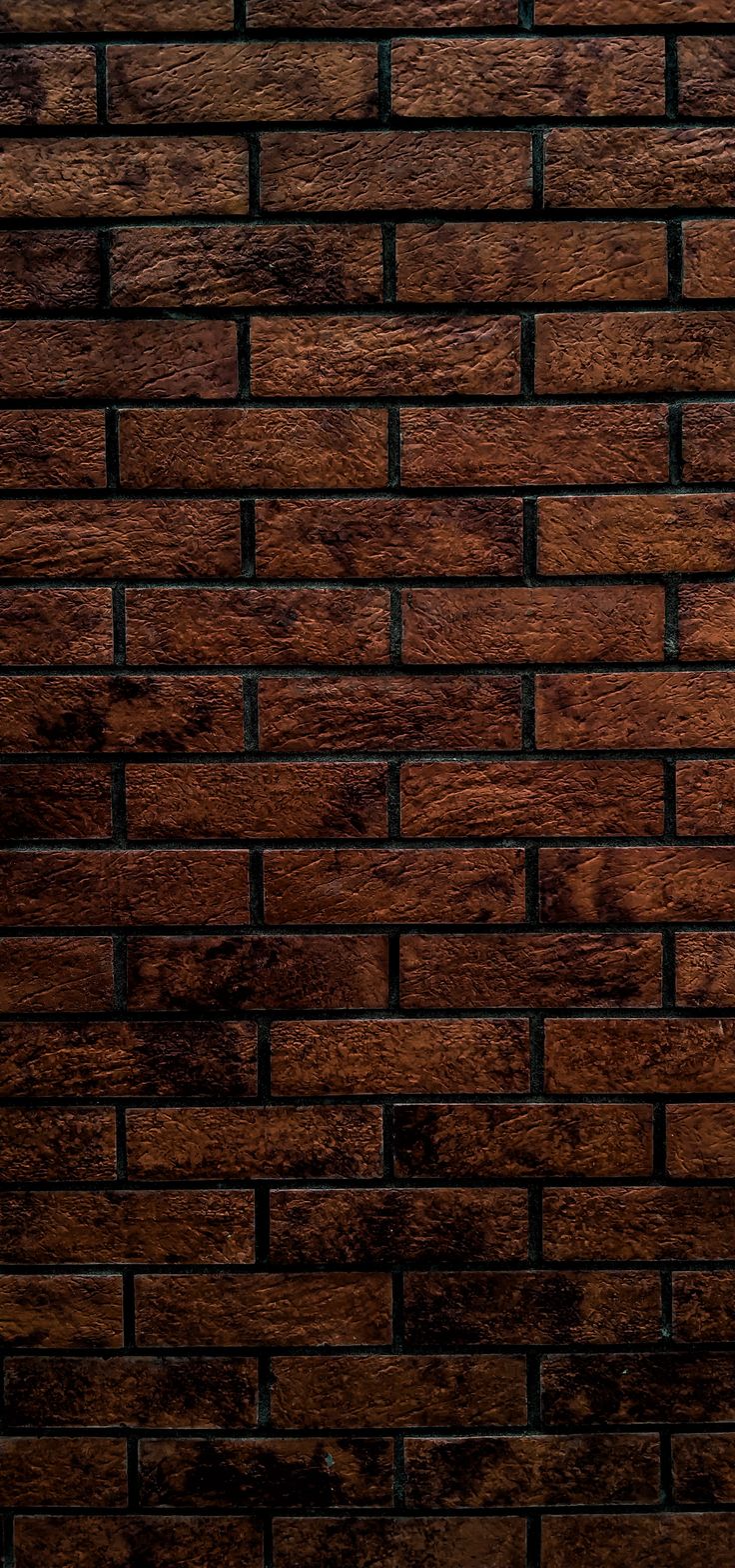 a brown brick wall that is made out of wood