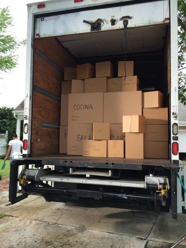 the back of a moving truck loaded with boxes