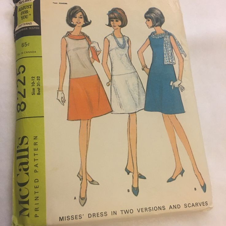 an old fashion book with two women's dresses on it