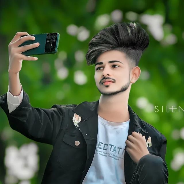 a young man taking a selfie with his cell phone in front of him while wearing a black jacket