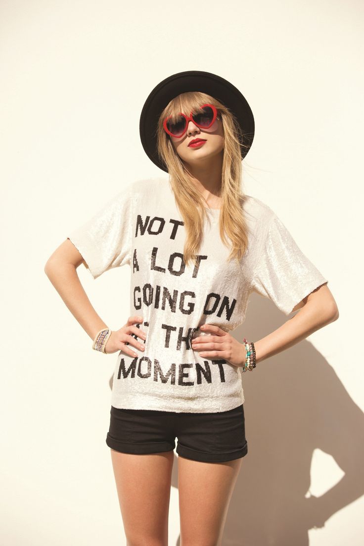 a woman wearing shorts and a t - shirt that says not a lot going on at the moment