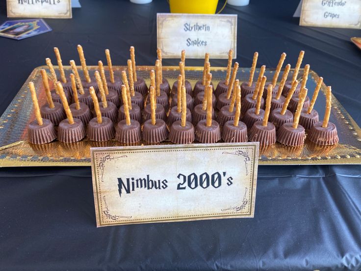 there are many chocolates on the table with name tags in front of each one