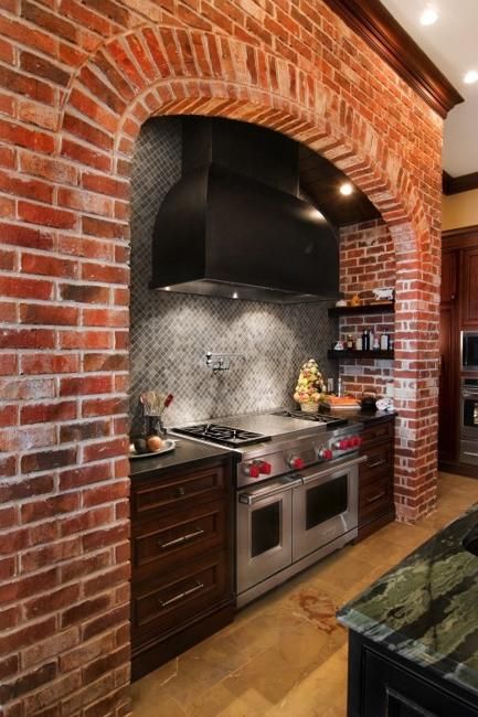 a kitchen with an oven, stove and counter top in it's center wall