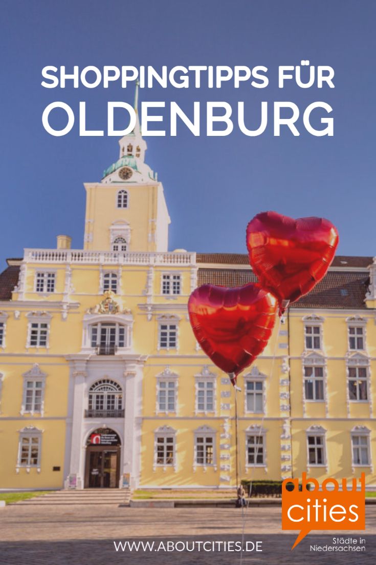 two red heart shaped balloons in front of a yellow building with the words shoppingtips fur oldenburg