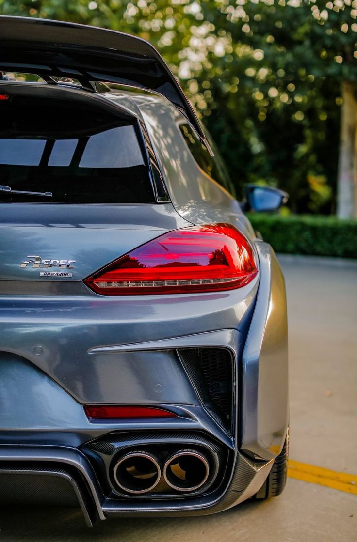 the rear end of a silver sports car