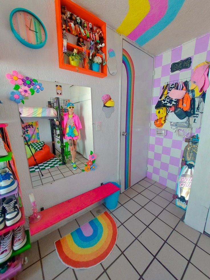 a room with a mirror, rug and toys on the floor