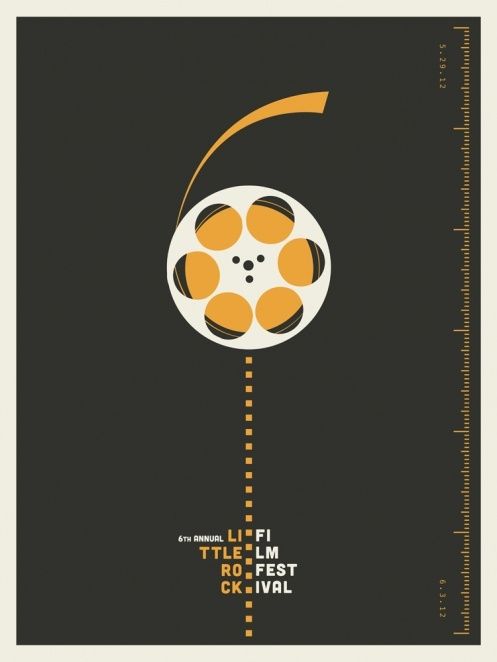 an orange and black movie poster with the film reel on it's end pointing upward