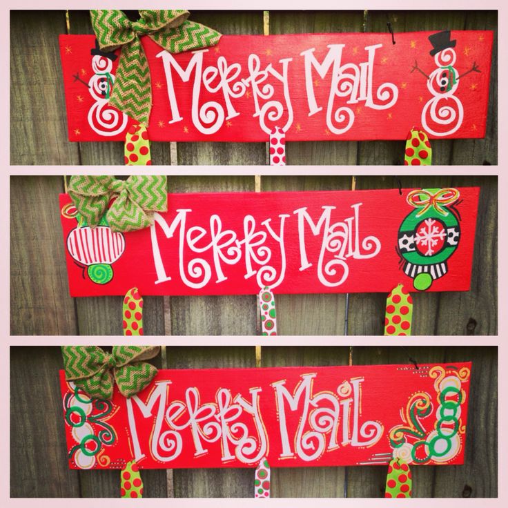 merry mail sign hanging on the side of a wooden fence with green and red bows