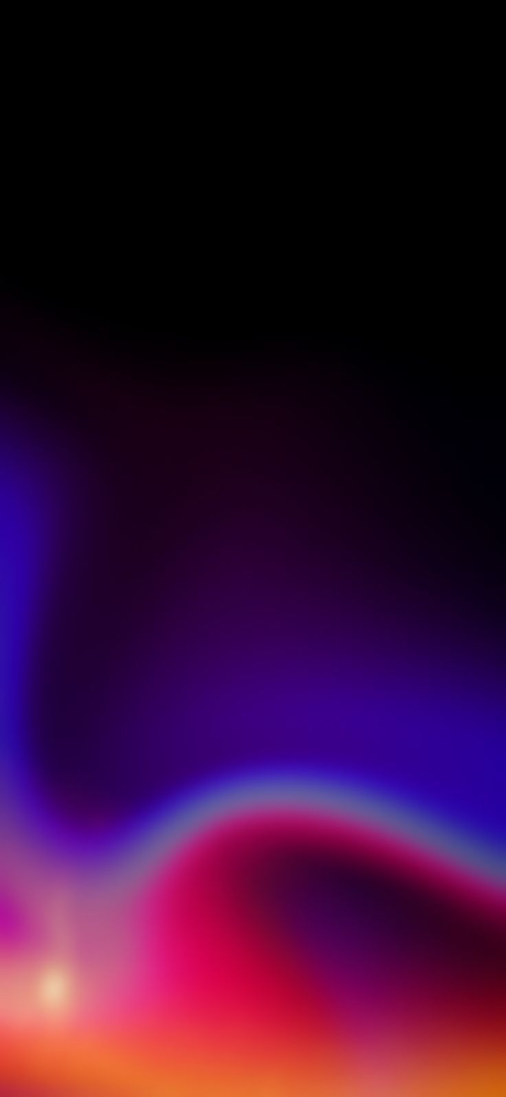a blurry image of an orange and purple wave on a black background is shown