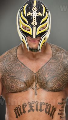 a man wearing a wrestling mask with tattoos on his chest