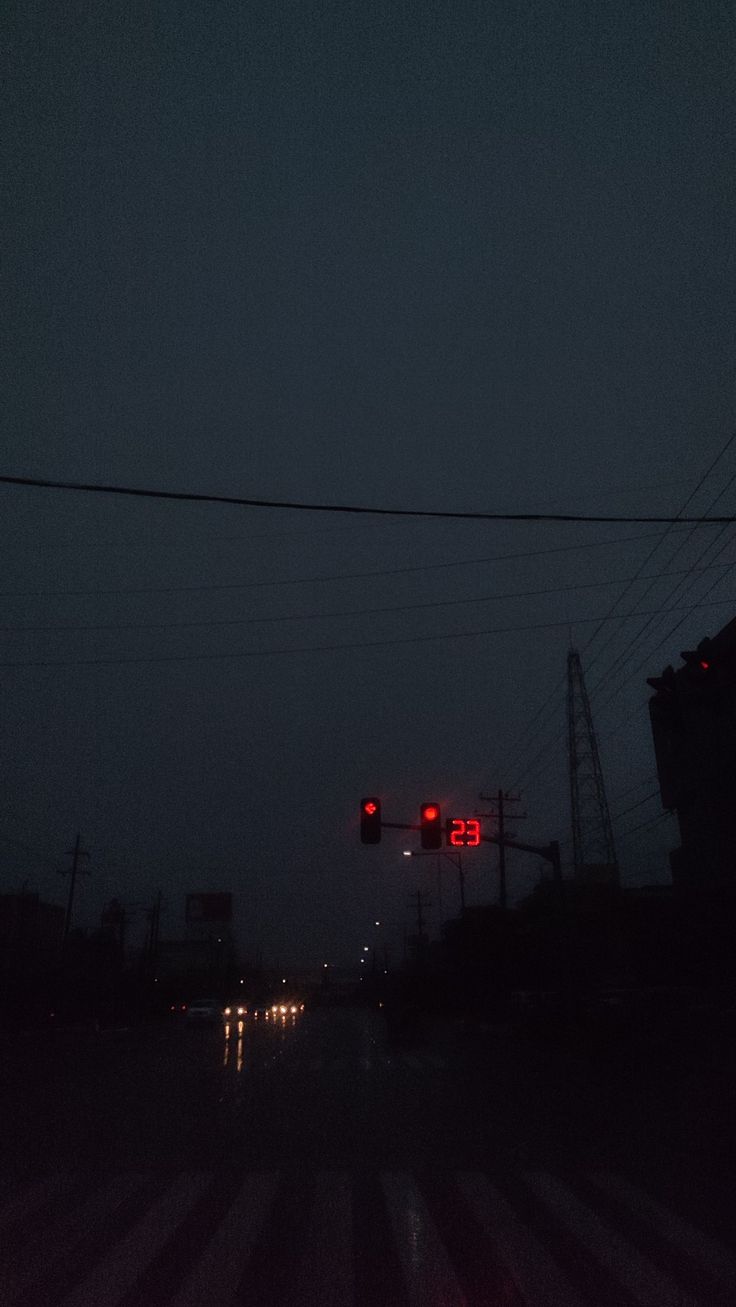 the traffic lights are red in the dark