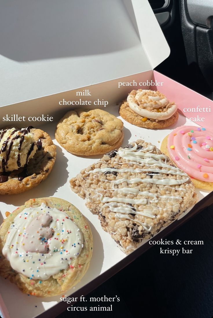 a box filled with lots of different types of cookies and ice creams on top of each other