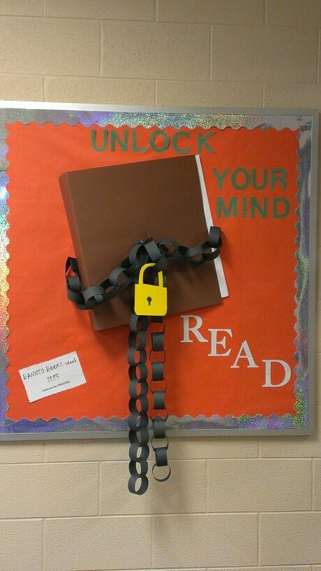 a bulletin board with a lock and chain attached to it