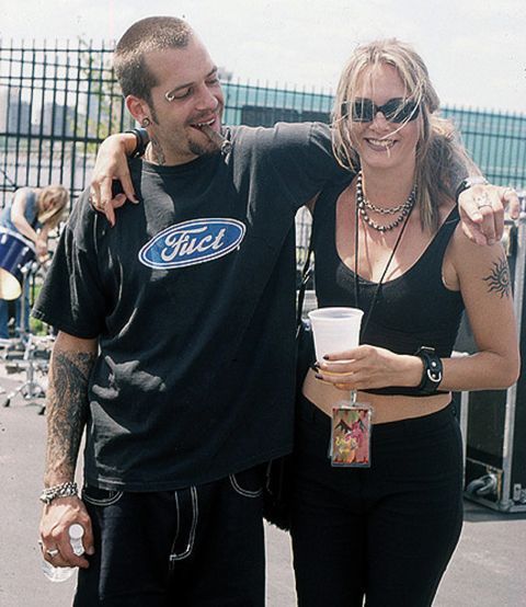 a man and woman standing next to each other