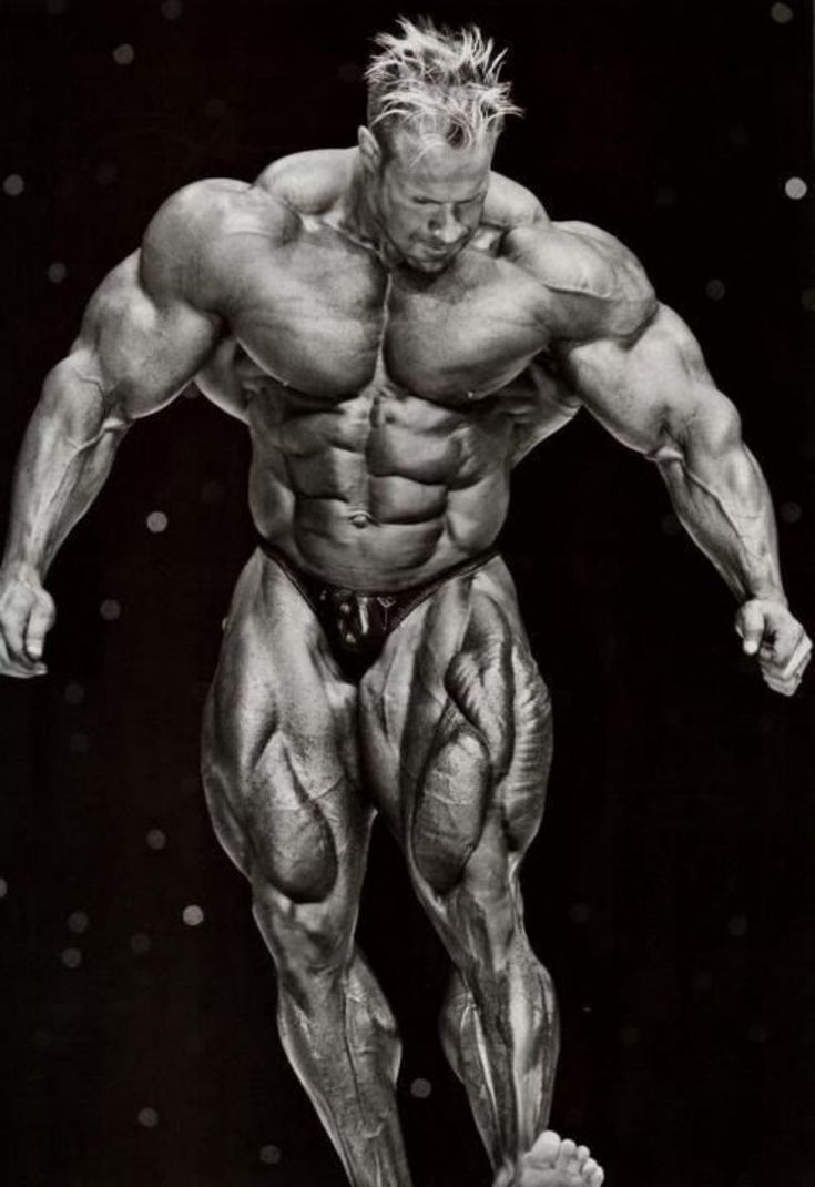 an image of a man with muscles on his chest and legs, posing for the camera