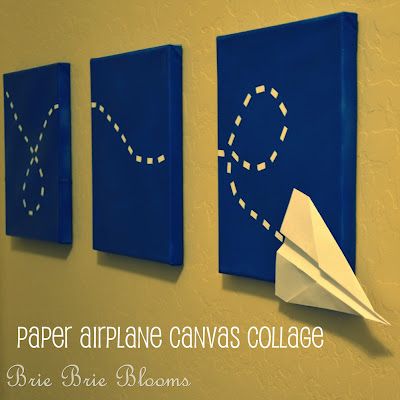 three blue canvass with white paper airplanes on them