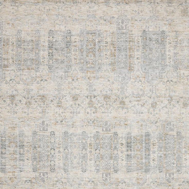 an area rug with many different colors and patterns on the carpet, including grays