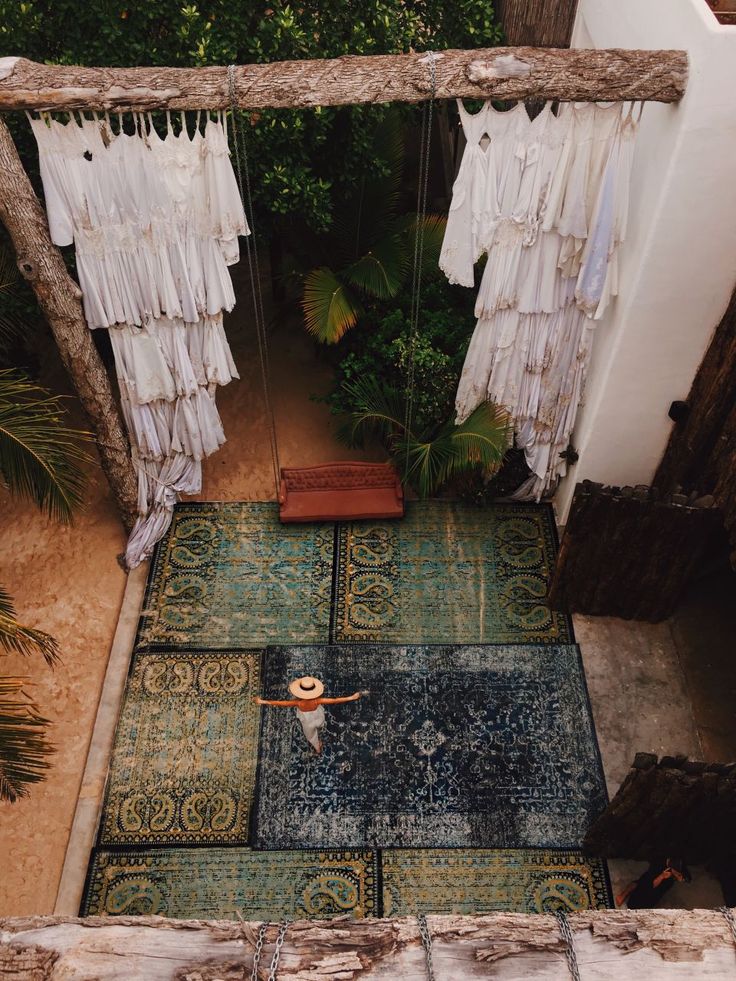 an overhead view of a rug with tassels hanging from it