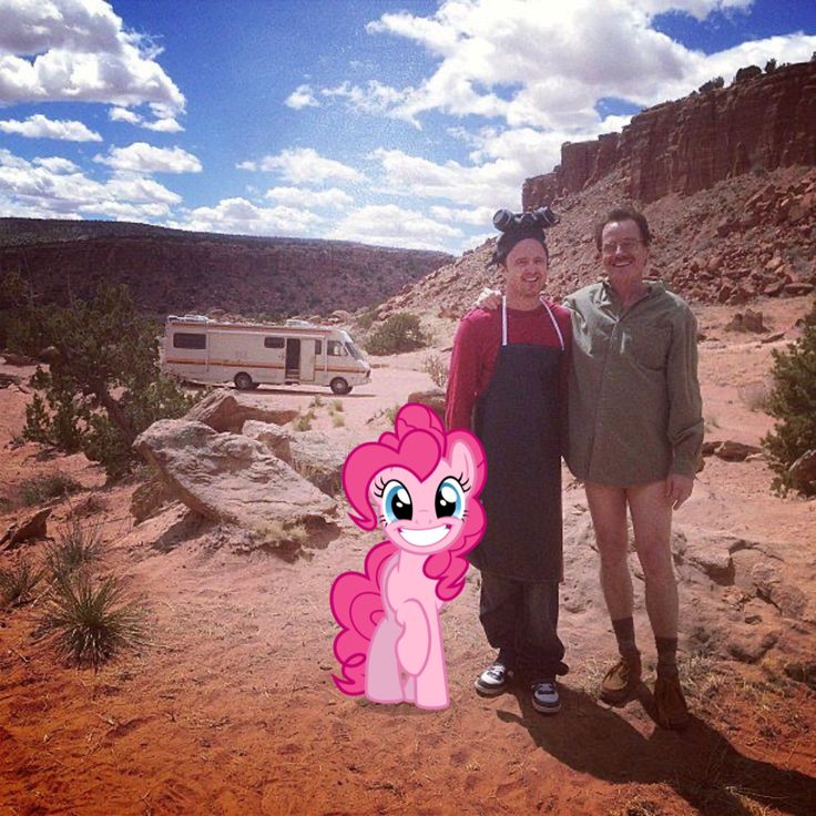 two people standing next to each other in the desert