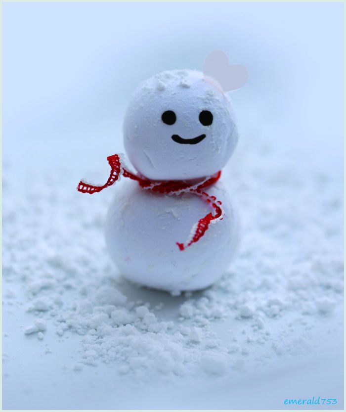 a snowman with a red scarf around his neck