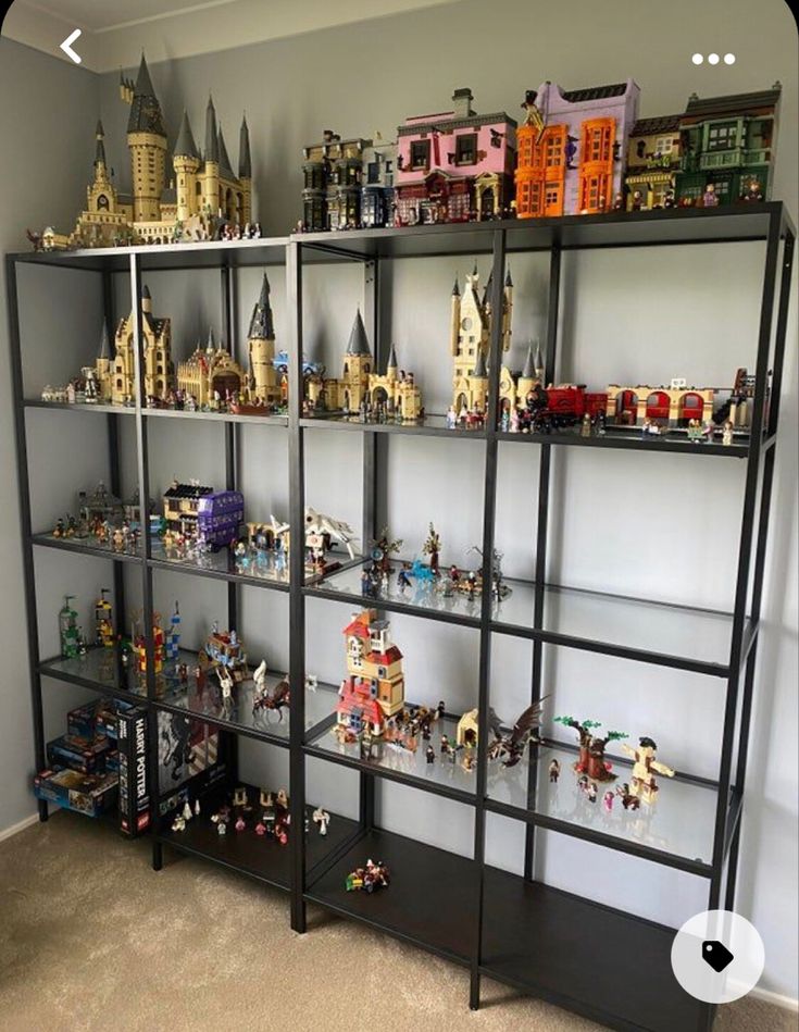 a shelf filled with lots of legos on top of each other in a room