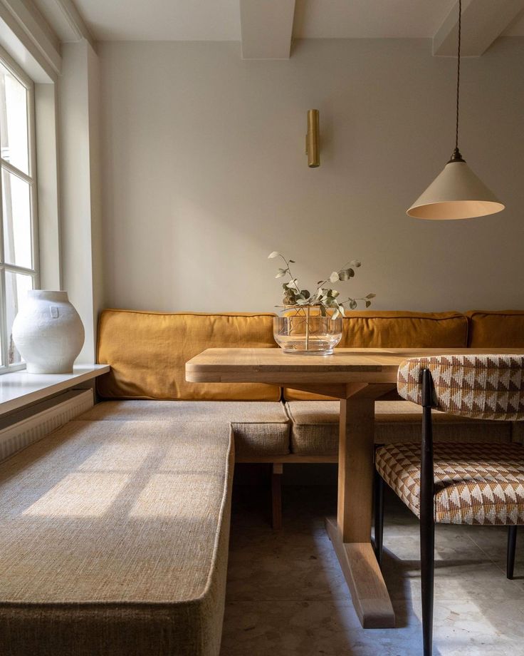 a living room filled with furniture next to a window