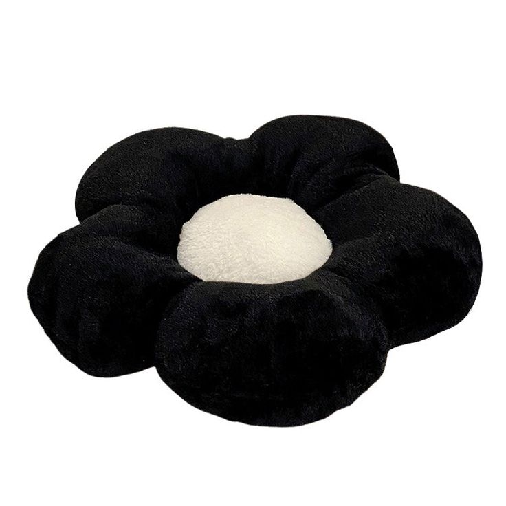 a black and white flower shaped pillow