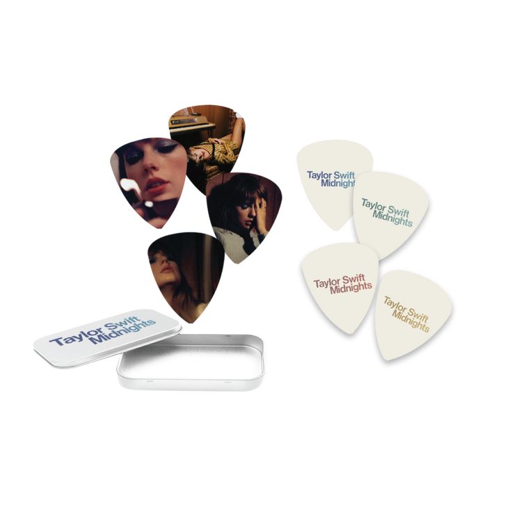 four guitar picks with different pictures on them