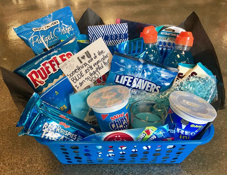 a blue basket filled with snacks and drinks