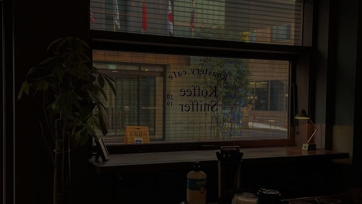 there is a sign on the window in the room that says kollete miller