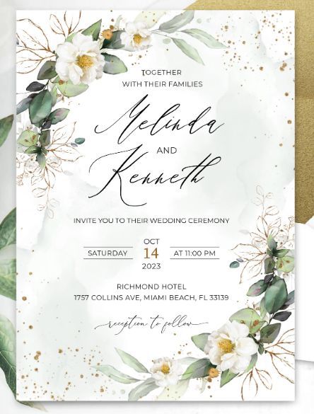 an elegant wedding card with white flowers and greenery on the front, in gold foil