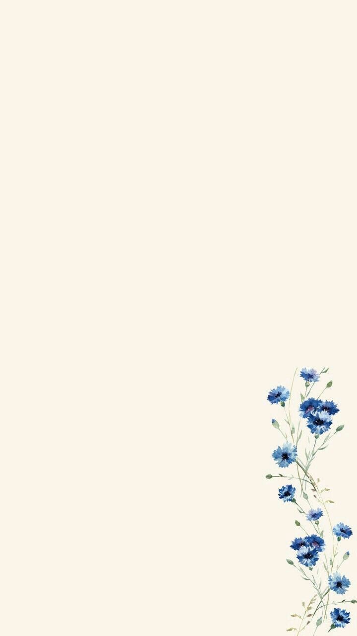 blue flowers on a white background with space for text in the bottom right hand corner