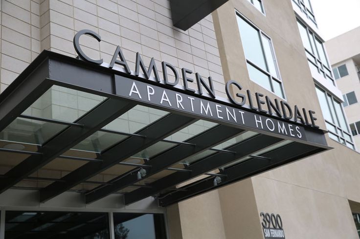an apartment building with the name camden glenndale on it's front door and windows