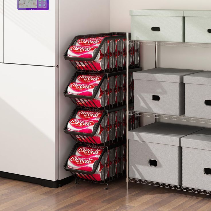 several cans of coca - cola are stacked on shelves next to bins and drawers