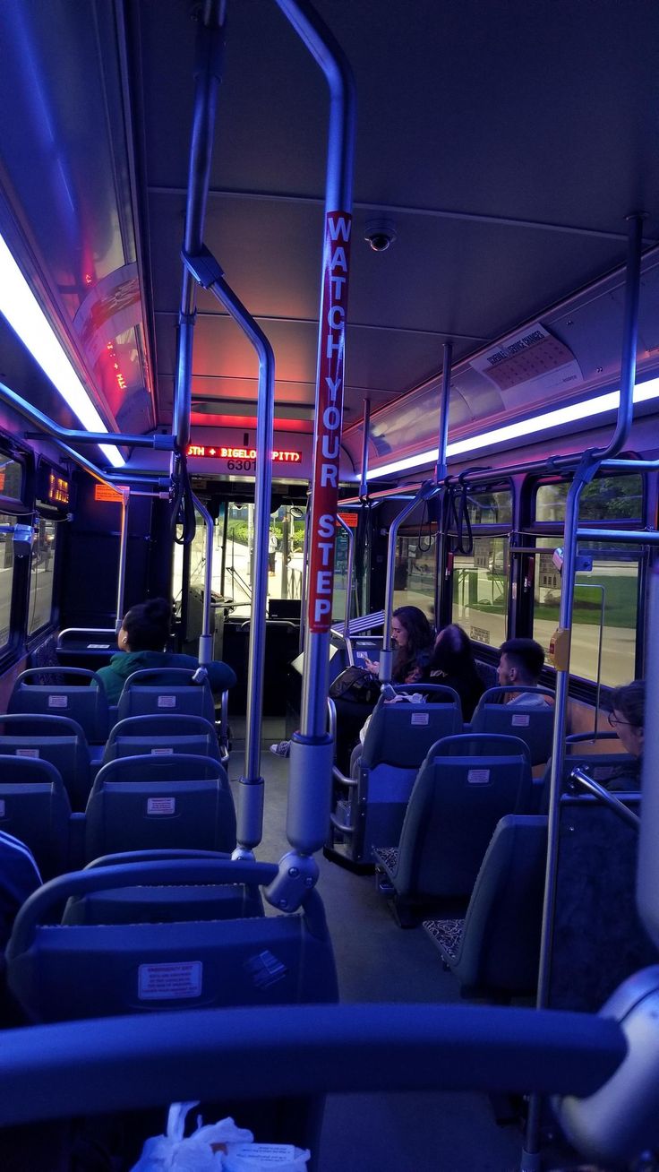 the interior of a public transit bus at night