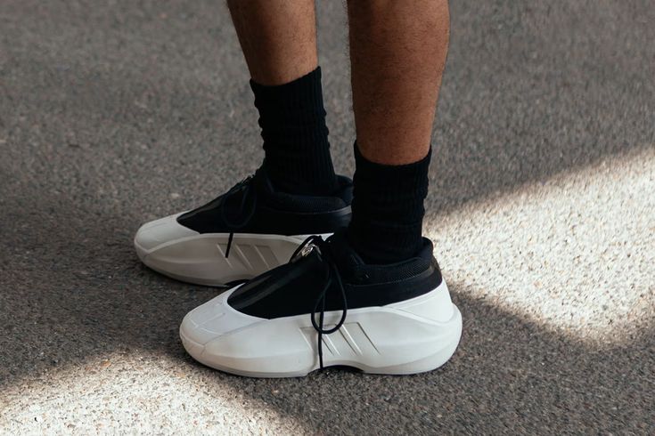 a person with black socks and white sneakers