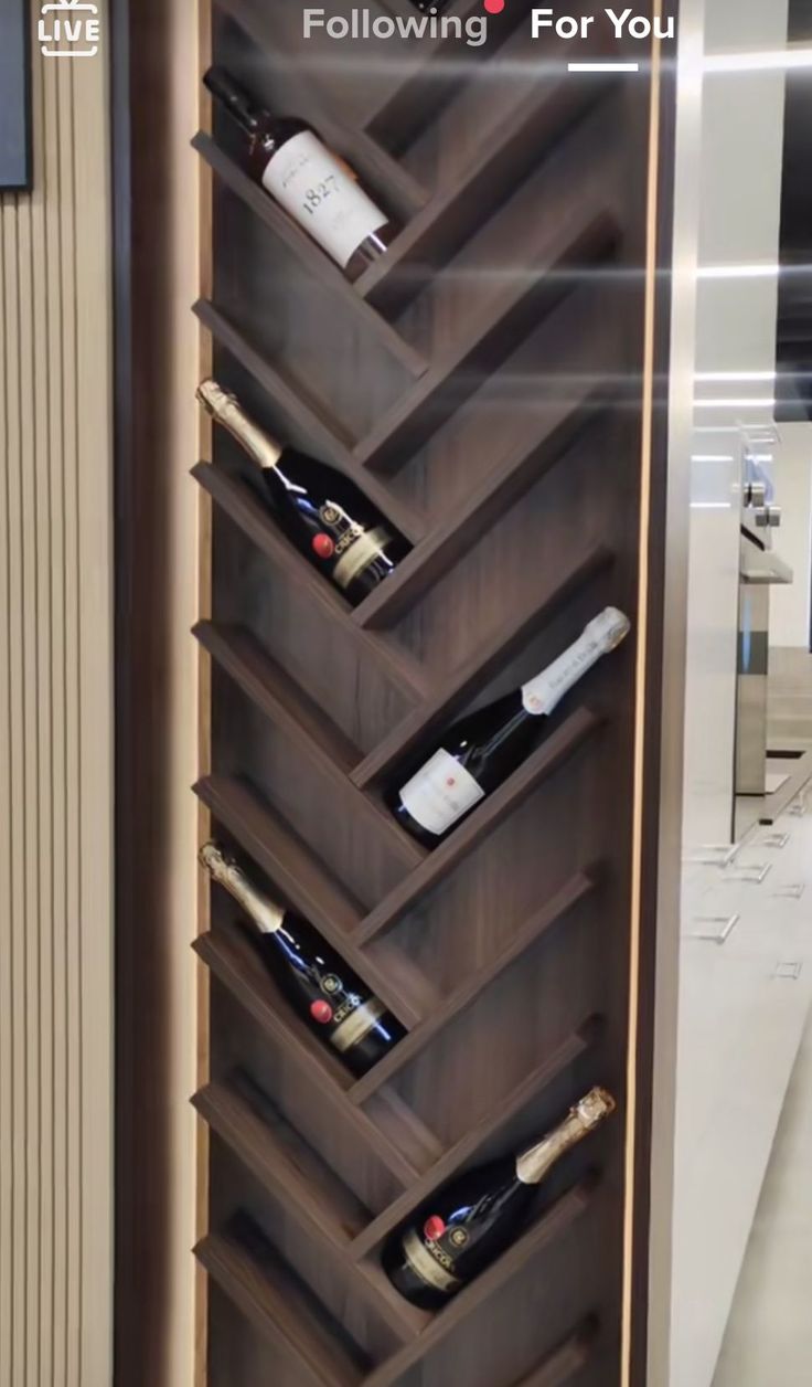 a wine rack with several bottles in it