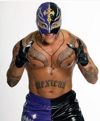 a man with tattoos on his chest wearing a wrestling mask and black gloves, standing in front of a white background