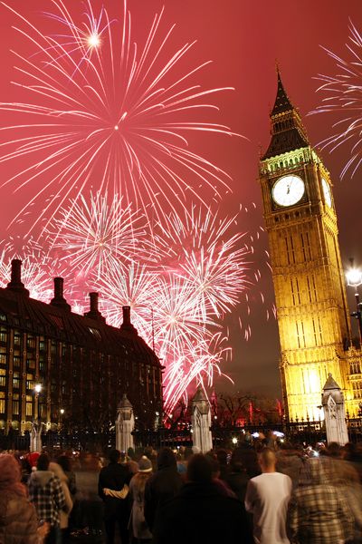 fireworks are lit up in the sky above big ben