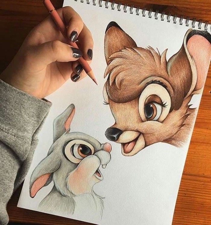 someone is drawing an animal with colored pencils on paper that looks like the fox and the hound from disney's live - action movie
