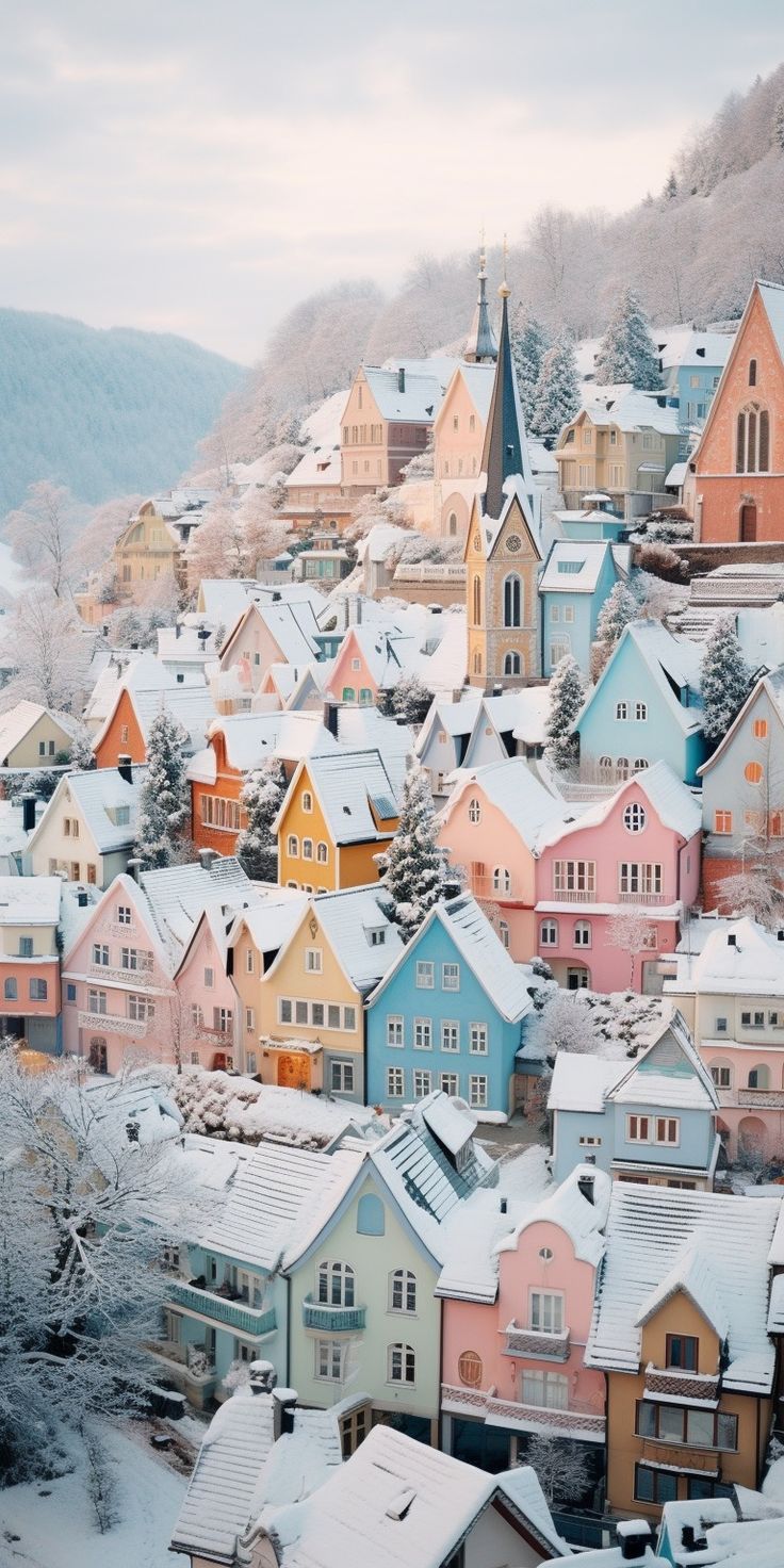 the colorful houses are all covered in snow