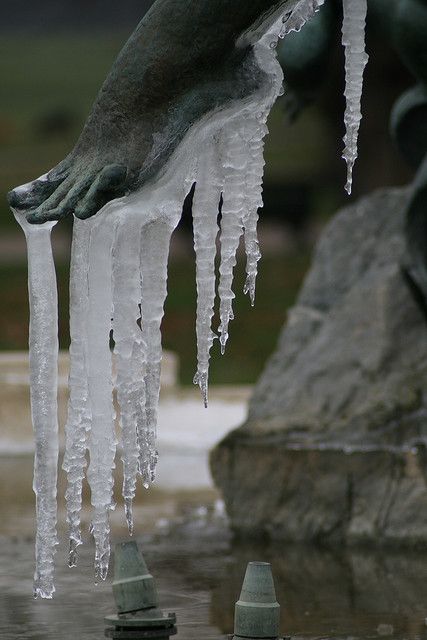 the statue is covered in ice and icicles