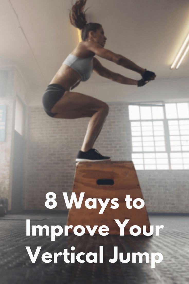 a woman standing on top of a wooden box with the words 8 ways to improve your vertical jump