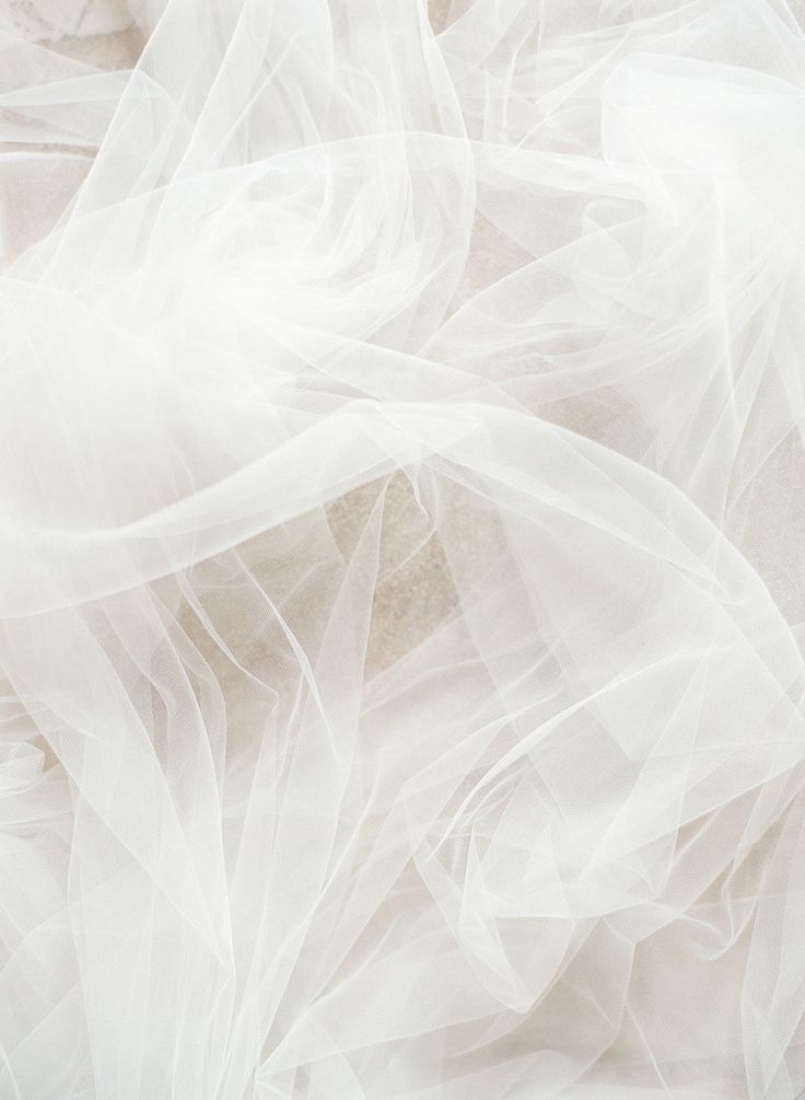 an image of white fabric textured with tulle on the floor for use as background