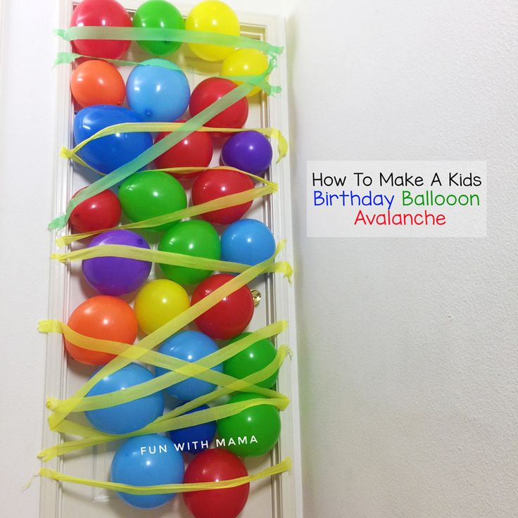 balloons and streamers are tied to the door for a birthday balloon wall art project